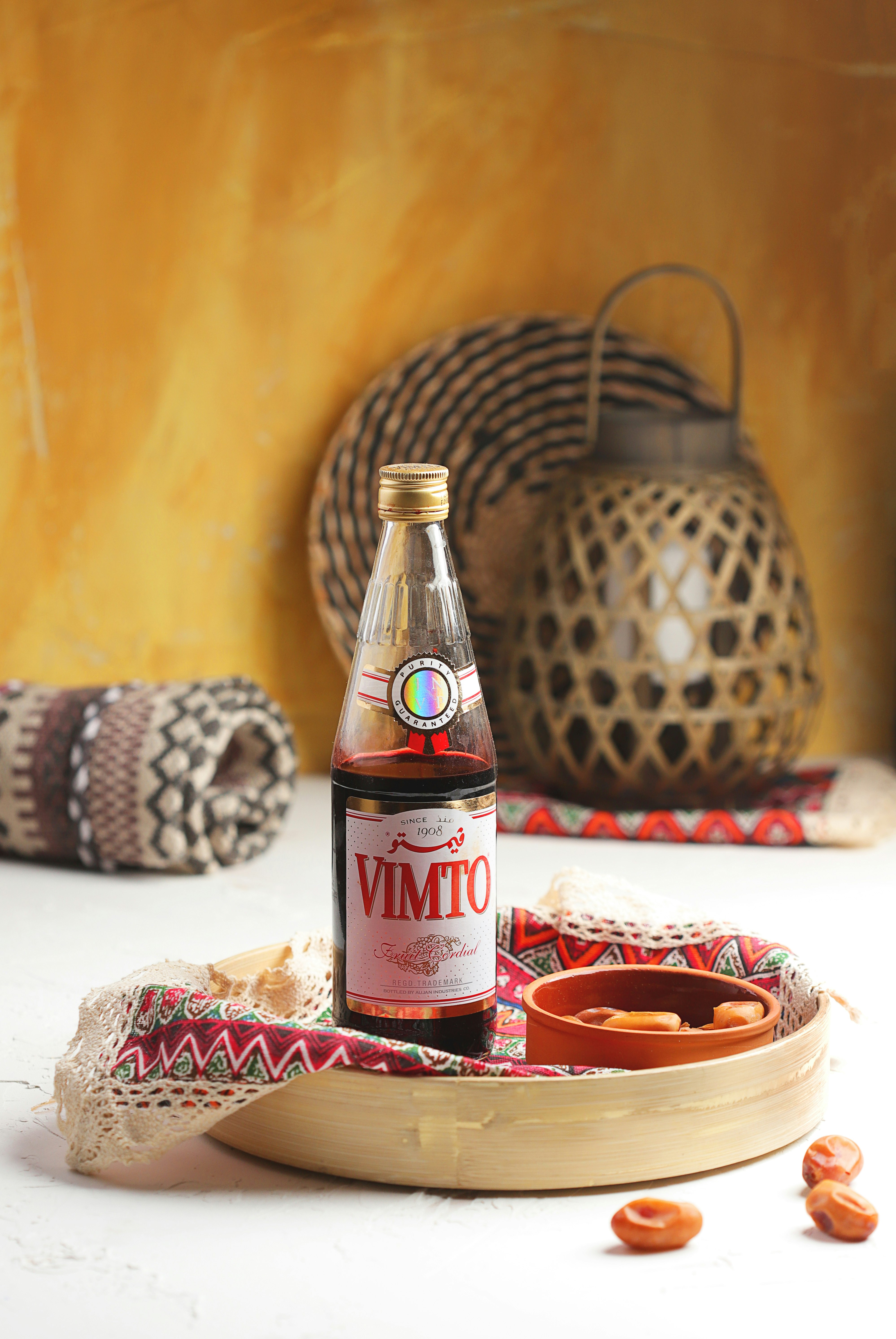 coca cola bottle beside brown and white ceramic bowl